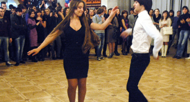 Students dancing lezginka at the first-year-students' party organized by "Elbrusoid" foundation in the Moscow Concert Hall "Izmailovsky", February 26, 2011.