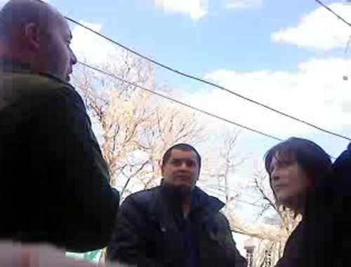 Unknown persons who presented themselves as employees of the Ministry of Defense of South Ossetia and Inara Gabaraeva, April 14, 2011. Frame from video record made by telephone