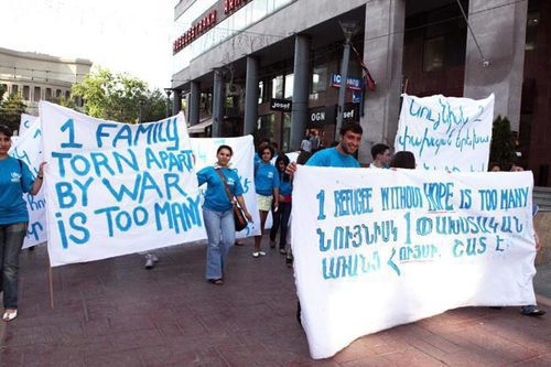 Armenian refugees from Azerbaijan march along streets with posters. Yerevan, June 20, 2011. Photo: Photolure