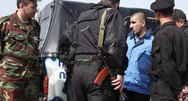 The Armenian party delivers an Azeri prisoner of war at the section of the Armenian-Azerbaijani border near the village of Eraskhavan, April 7, 2010. Photo: www.panarmenian.net