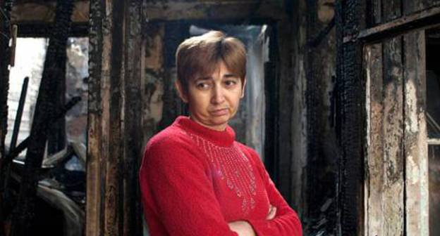 Siranush Sakunts, a resident of the burnt-down house in Koryun Street, amidst ashes. Yerevan, November 26, 2010. Photo: Nazik Armenakyan, Armenianow.com