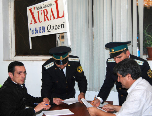 Policemen sequestrate the property of the editorial office of the "Khural" newspaper, Baku, Azerbaijan, October 19, 2011. Photo by the Institute for Reporters' Freedom and Safety (www.irfs.az)