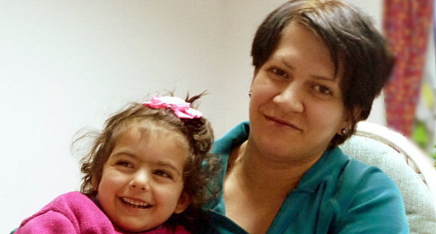 Maryam Arutyunyan with her daughter Tatev, a tenant of the Charity House of the Fund "Paros" (Lighthouse), which provides shelter to women-victims of domestic violence, Armenia, Ptkhunk village, 2012. Photo by Armine Martirosyan for the "Caucasian Knot"