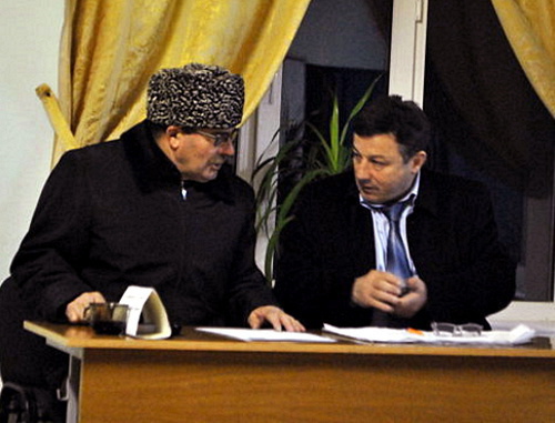 Magomed Idrisov (on the right), Chairman of the Precinct Election Commission (PEC) No. 1147, with some unidentified person, who accused observers from the "Novaya Gazeta" of illegal agitation, Dagestan, Makhachkala, March 4, 2012. Photo by Gurizada Kamalova, http://gurizada.livejournal.com/