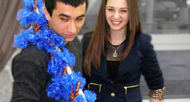 The third Circassian folk game in Adygea, Maikop, March 24, 2012; a student from Syria Umaf Meshvez, the game facilitator, holds the rod named "Dazhue Besch" which means "a stick with a hazelnut". Photo by Oleg Chaly for the "Caucasian Knot".