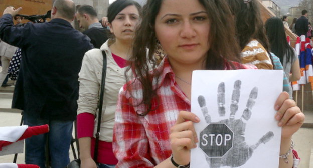 Nagorno-Karabakh, Stepanakert, April 9, 2012, a participant of the march dedicated to the 20th anniversary of tragic events in the village of Maraga. Photo by Alvard Grigoryan for the "Caucasian Knot"