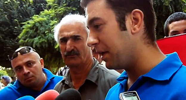 Action demanding to help in repatriation of Syrian Armenians organized by the youth union "Ayazn"; Yerevan, July 19, 2012. Still from video footage by the "Hetq.am"