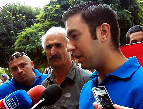 Action demanding to help in repatriation of Syrian Armenians organized by the youth union "Ayazn"; Yerevan, July 19, 2012. Still from video footage by the "Hetq.am"