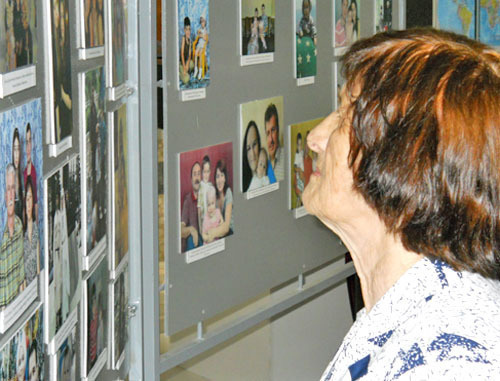 Exhibition dedicated to Repatriate's Day held in Maikop; visitor are reviewing the photos; Republic of Adygea, Maikop, July 30, 2012. Photo by Oleg Chaly for the "Caucasian Knot"