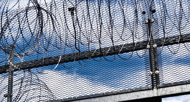 Prison fence. Courtesy of http://www.flickr.com/photos/x1klima/7637108374