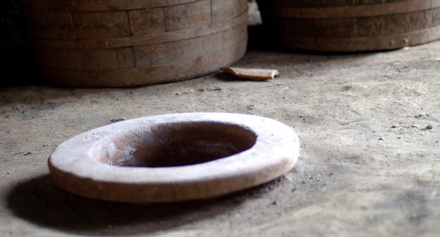 Neck of the traditional vessel named kvevri and used for storing wine is immersed and fixed in the floor, Georgia, Marneuli. Photo: Susan Astray, http://www.flickr.com/photos/susanastray