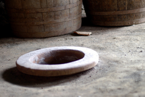 Neck of the traditional vessel named kvevri and used for storing wine is immersed and fixed in the floor, Georgia, Marneuli. Photo: Susan Astray, http://www.flickr.com/photos/susanastray