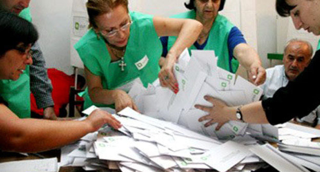 Vote tabulation at a polling station on the voting day Georgia. Courtesy of the http://pik.tv