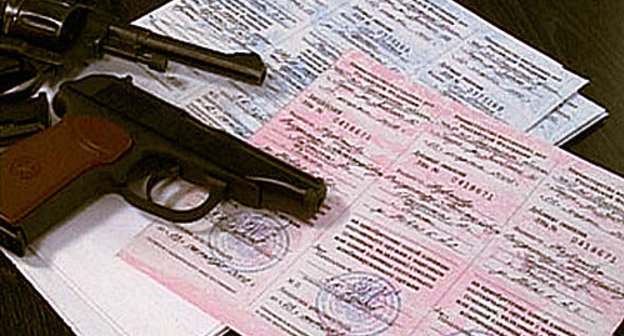 Weapon licenses and guns. Photo from http://07.mvd.ru