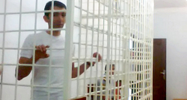 Human rights activist Talekh Khasmamedov behind bars at the Shirvan Court of Appeal; October 9, 2012. Photo by Oktai Gyulalyev