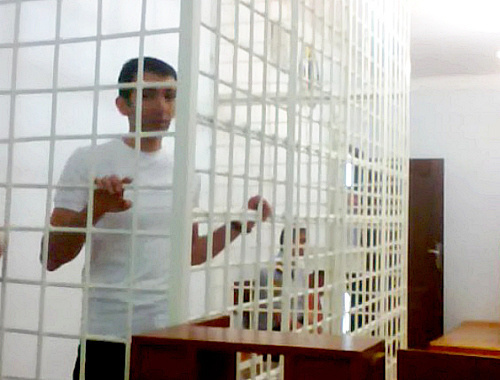 Human rights activist Talekh Khasmamedov behind bars at the Shirvan Court of Appeal; October 9, 2012. Photo by Oktai Gyulalyev