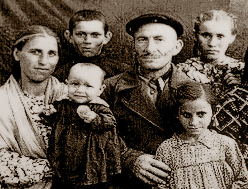 Dalkhat Lokmanovich Kholaev in exile with his family in the Jalalabad Rgion, Kyrgyz SSR. Photo frpm the fund of the Memorial Museum of Repressions and Genocide of Balkar People in 1944-57: http://www.gulagmuseum.org