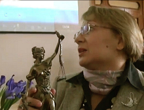 PDI director Leyla Yunus presents Isakhan Ashurov Prize to Hilal Mamedov's lawyer Ramiz Mammadov. Baku, Azerbaijan, March 29, 2013. A still from the video clip by Obyektiv Tv, www.obyektiv.tv