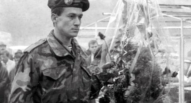 Abkhazian volunteers laying flowers at the boulder set in honour of the casualties victims of the 1992-1993 Georgian-Abkhaz conflict; Nalchik, Abkhazian Square, 1996, Courtesy of the magazine "Archives and Society", No. 18