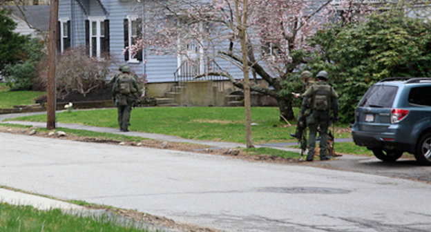 New Hampshire State troopers canvas a neighborhood in Watertown, Mass., April 19, 2013. Photo: Sally Vargas, Talk Radio News Service, http://www.flickr.com/photos/talkradionews/8664228538 