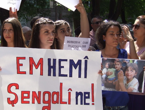 Solidarity action with Iraqi Yazidis, Tbilisi, August 6, 2014. The poster says: ‘We’re all together with you!’ Photo by Edita Badasyan for the ‘Caucasian Knot’.