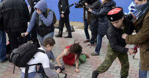 A brawl between Cossaks and Pussy Riot band. Photo by Mikhail Mordasov, Yugopolis.