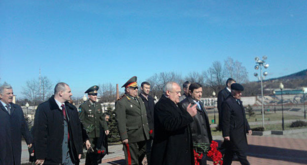 Taimuraz Mamsurov (with flowers, in a coat) and Alexander Khloponin (on his left), Plenipotentiary of the new North-Caucasian Federal District (NCFD). February 23, 2010. Photo by the "Caucasian Knot"