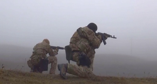 The law enforcers during special operation in the village of Kvanada. Screenshot of a video by NAC, youtube.com/watch?v=__MAWbCnsZA