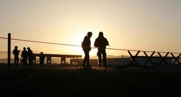 Law enforcers at the police checkpoint on the border of North Ossetia and Ingushetia. Photo by Kazbek Basaev, Reuters