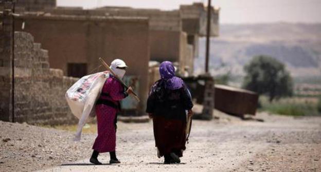 Women with white frag in Raqqa, Syria. Photo: Rodi Said/Reuters