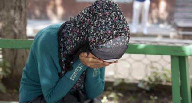 Crying woman, Grozny. Photo: RFE/RL