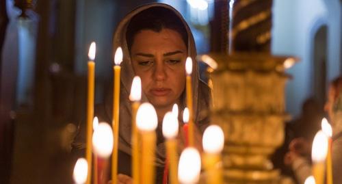 A woman believer in an Orthodox church. Photo by Aziz Karimov for the  "Caucasian Knot"