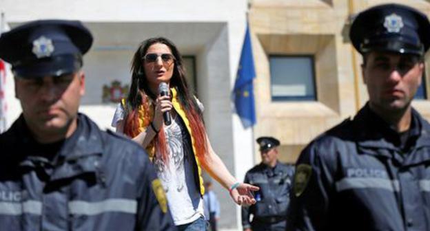 LGBT activist surrounded by policemen delivers speech, Tbilisi, May 2017. Photo: REUTERS/David Mdzinarishvili 