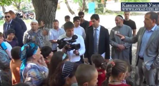 Evkurov meets forced migrants, Karabulak, July 2, 2014. Screenshot of the Caucasian Knot video