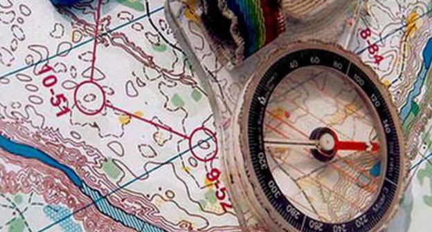 Compass and map. Photo: Chief Department for Chuvash Republic of the Ministry of Emergency Situations of Russia