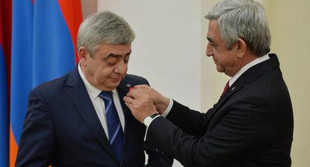 Serzh Sargsyan, a President of Armenia,  gives an award to his brother Levon Sargsyan. Photo by the press service of the President of Armenia http://www.president.am