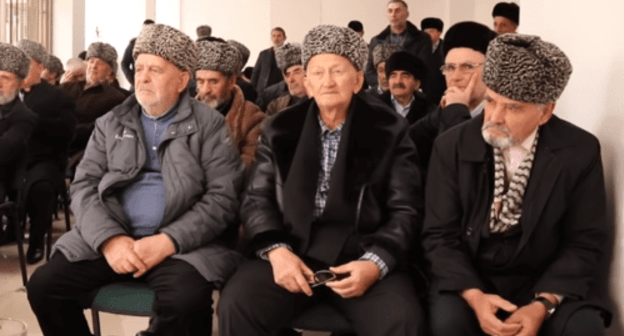 Members of the Council of Teips of the Ingush People listening to the "Appeal to the leadership and people of the Chechen Republic". Screenshot from the video appeal dated December 7 2018. https://youtu.be/waLyRPxTXQM