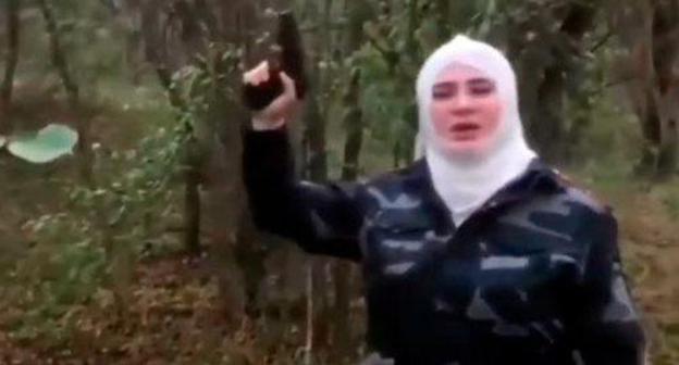 Resident of North Ossetia holding pistol. Screenshot from video posted by 'Chechnya Segodnya' at https://www.youtube.com/watch?time_continue=10&v=nOp1_XDAsSo