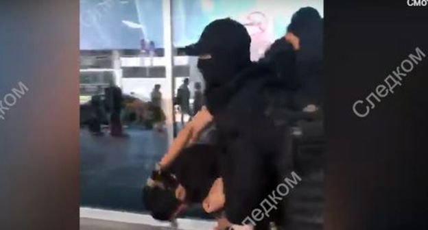 Detention on the charge of financing a terrorist organization. Screenshot from video posted by the Investigating Committee of the Russian Federation, https://www.youtube.com/channel/UCOiAwKQuFMdJuK7wwDIoKpA