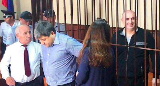 Musa Musaev in the courtroom (right) and his advocates. Photo by Patimat Makhmudova for the Caucasian Knot