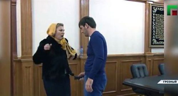 Islam Kadyrov applies an electric shocker (stun gun) to a woman. Photo: screenshot of the video by the Grozny TV channel https://www.youtube.com/watch?time_continue=1&amp;v=BpjWCGHbJ6E