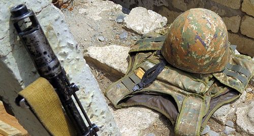 A gun and military uniform, Nagorno-Karabakh. Photo by Alvard Grigoryan for the Caucasian Knot