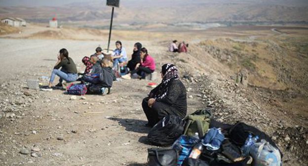 Women in a frontline zone in Syria. Photo: REUTERS/Muhammad Hamed