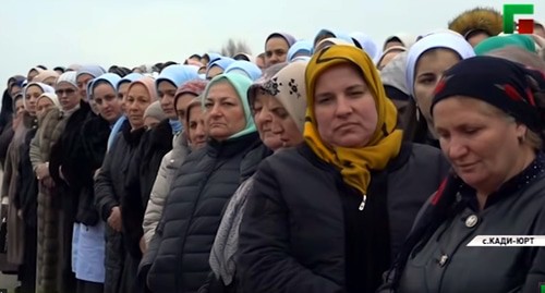 Participants of the ceremony held after the construction of new houses in Kadi-Yurt on December 24, 2019. Screenshot of the video by the "Grozny" TV channel https://www.youtube.com/watch?v=PjDss8DtPFk&amp;feature=emb_logo