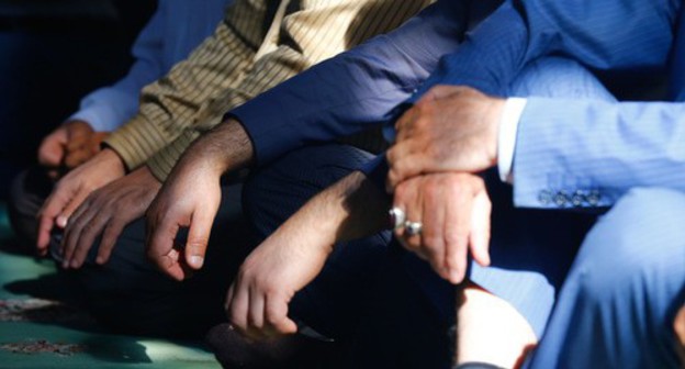 Hand of people praying. Photo by Aziz Karimov for the Caucasian Knot