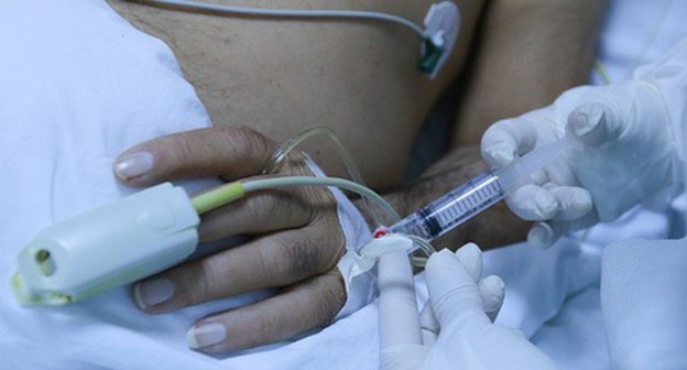 A doctor near a patient. Photo by Aziz Karimov for the "Caucasian Knot"