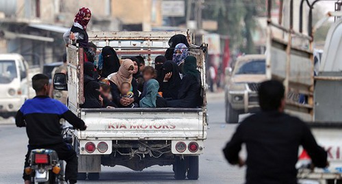 Women and children in the truck. Syria, October 2019. Photo: REUTERS/Khalil Ashawi