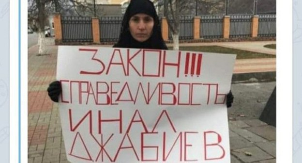 Inal Djabiev's relative standing in a solo picket. Screenshot https://t.me/osnovanews/3665