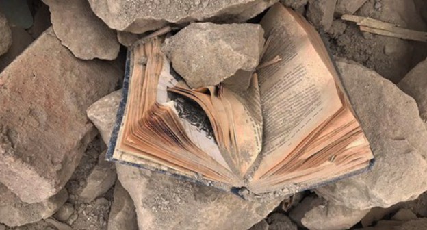 A book under the rubble of a home. November 2020. Photo by Alvard Grigoryan for the "Caucasian Knot"