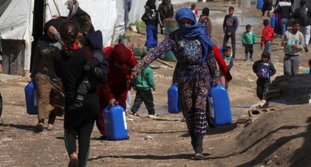 Syrian refugees in a tent camp. Photo: REUTERS/Mohamed Azakir